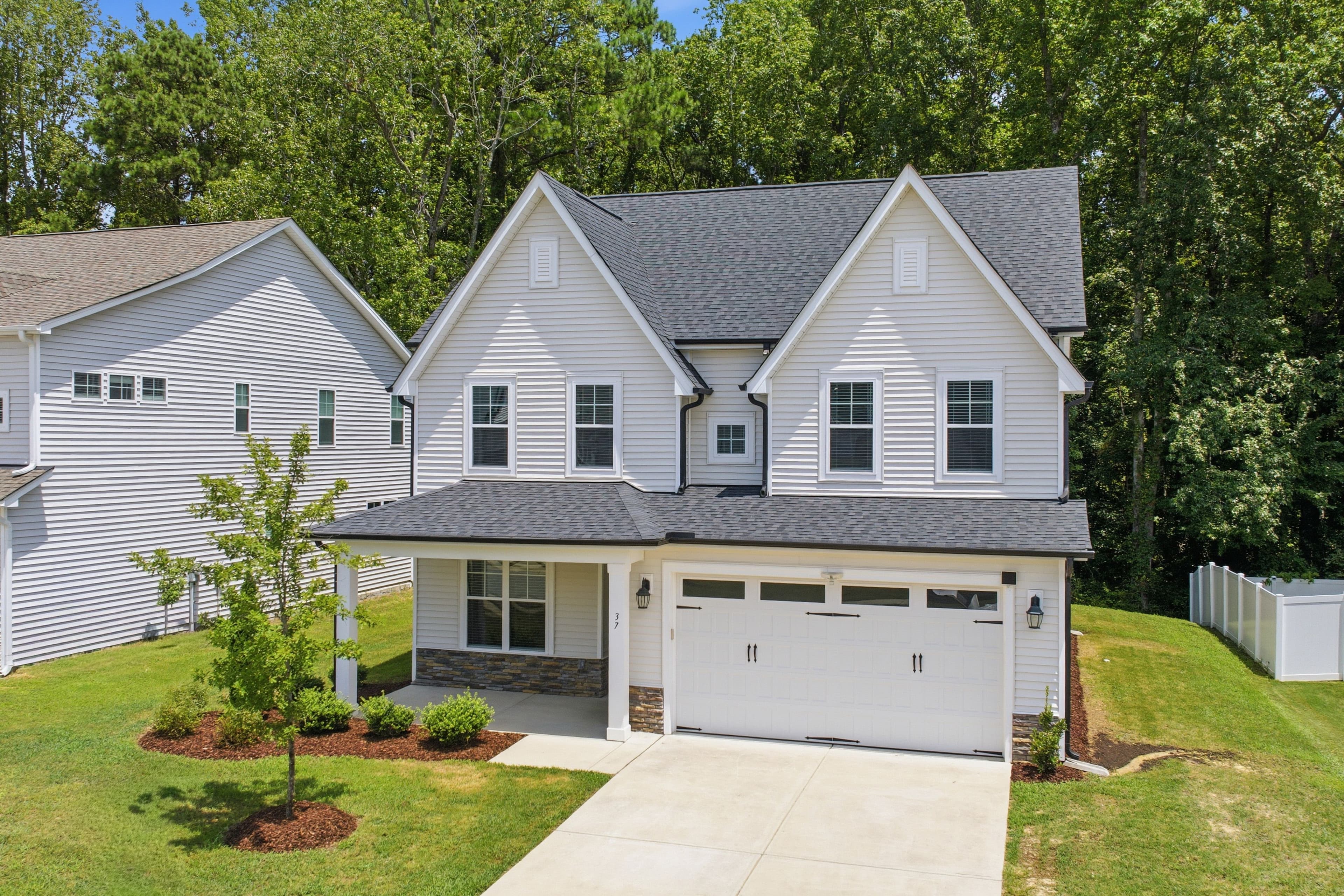 Exterior and backyard of 37 Willow Creek Drive, a completed MakeProp listing